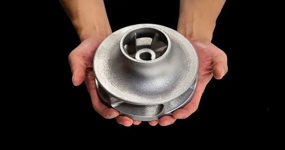 A person holding a 3D printed impeller made from Direct Metal Printing